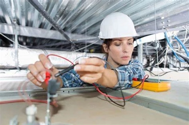 Picture of two Electrical Contractors viewing a theermal image of a breaker panel